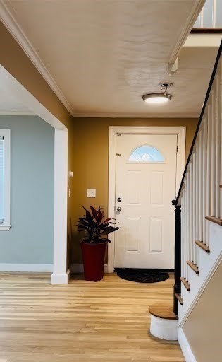 369 Union Street Ashland, MA 01721 - Photo 16 of 22 a view of a hallway with wooden floor and furniture