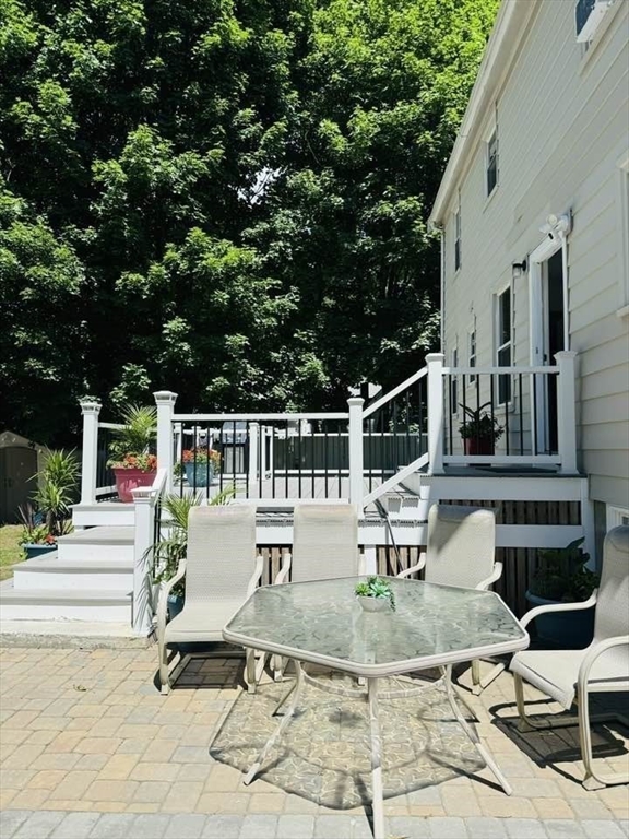 369 Union Street Ashland, MA 01721 - Photo 18 of 22 a view of a chair and tables