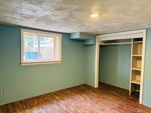 369 Union Street Ashland, MA 01721 - Photo 21 of 22 an empty room with wooden floor closet and windows