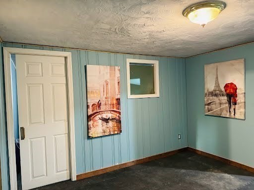 369 Union Street Ashland, MA 01721 - Photo 22 of 22 an empty room with wooden floor and window