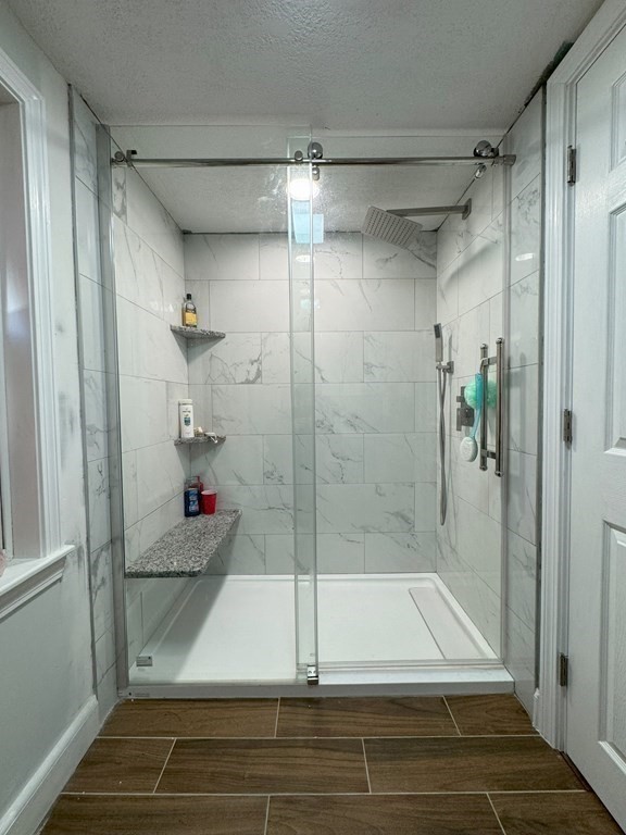 369 Union Street Ashland, MA 01721 - Photo 10 of 22 a bathroom with a shower