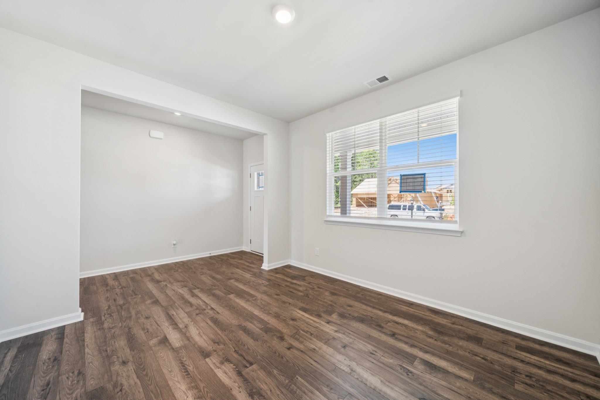 101 Stonewall Jackson Road Waynesboro, VA 22980 - Photo 14 of 30 a view of an empty room with wooden floor