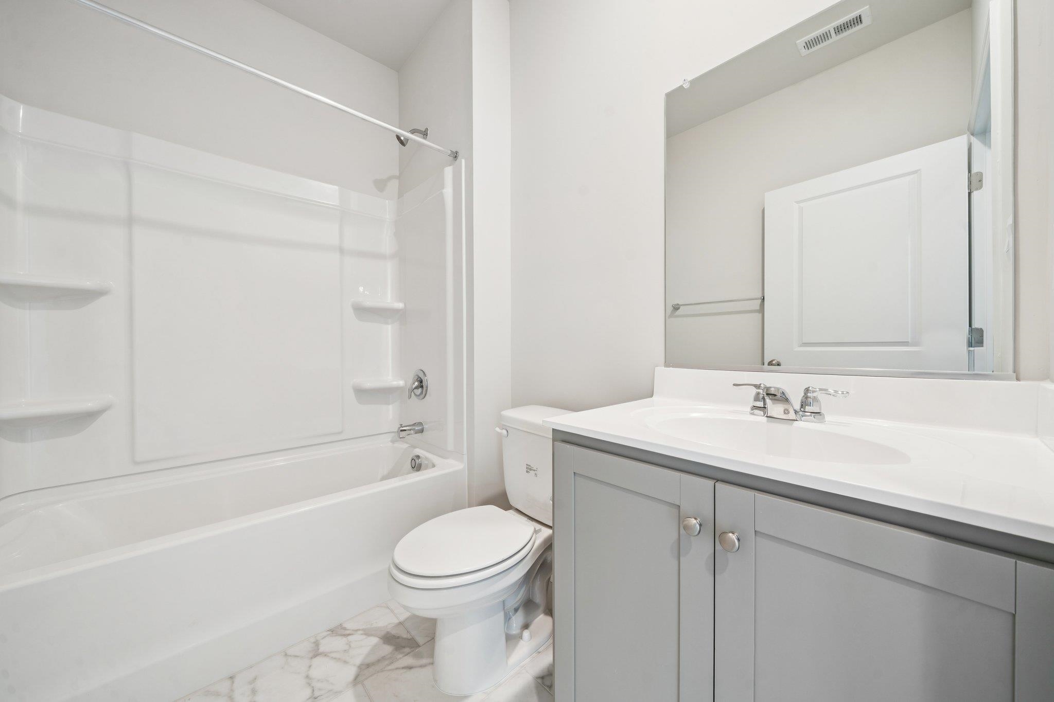 101 Stonewall Jackson Road Waynesboro, VA 22980 - Photo 29 of 30 a bathroom with a sink a toilet and a bathtub