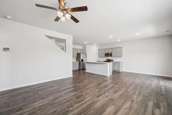 a view of kitchen with wooden floor and window