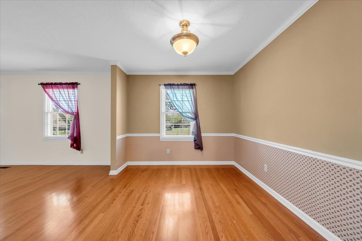 1587 Bypass Road Winchester, TN 37398 - Photo 13 of 26 a view of empty room with wooden floor and fan