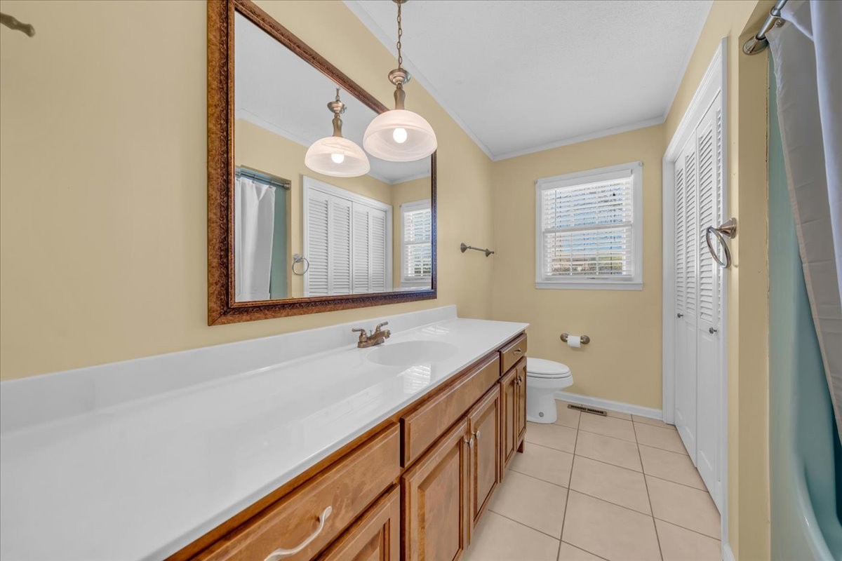 1587 Bypass Road Winchester, TN 37398 - Photo 23 of 26 a bathroom with a sink a vanity and a large mirror