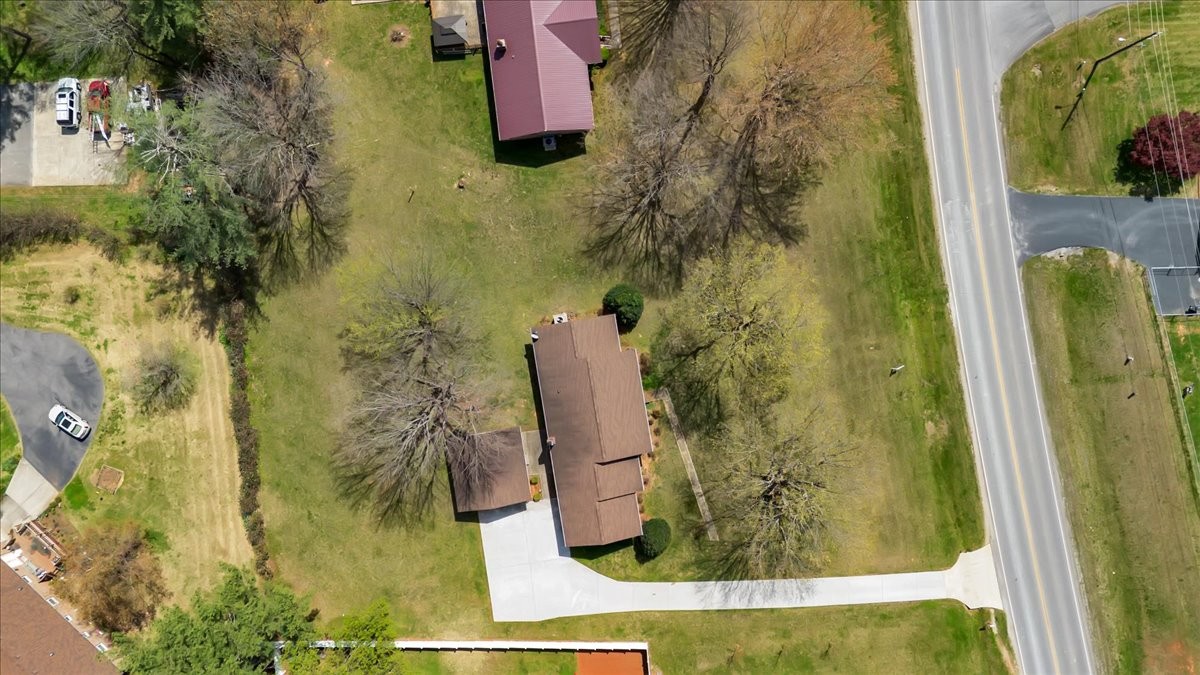 1587 Bypass Road Winchester, TN 37398 - Photo 25 of 26 a bathroom with a granite countertop shower and a mirror
