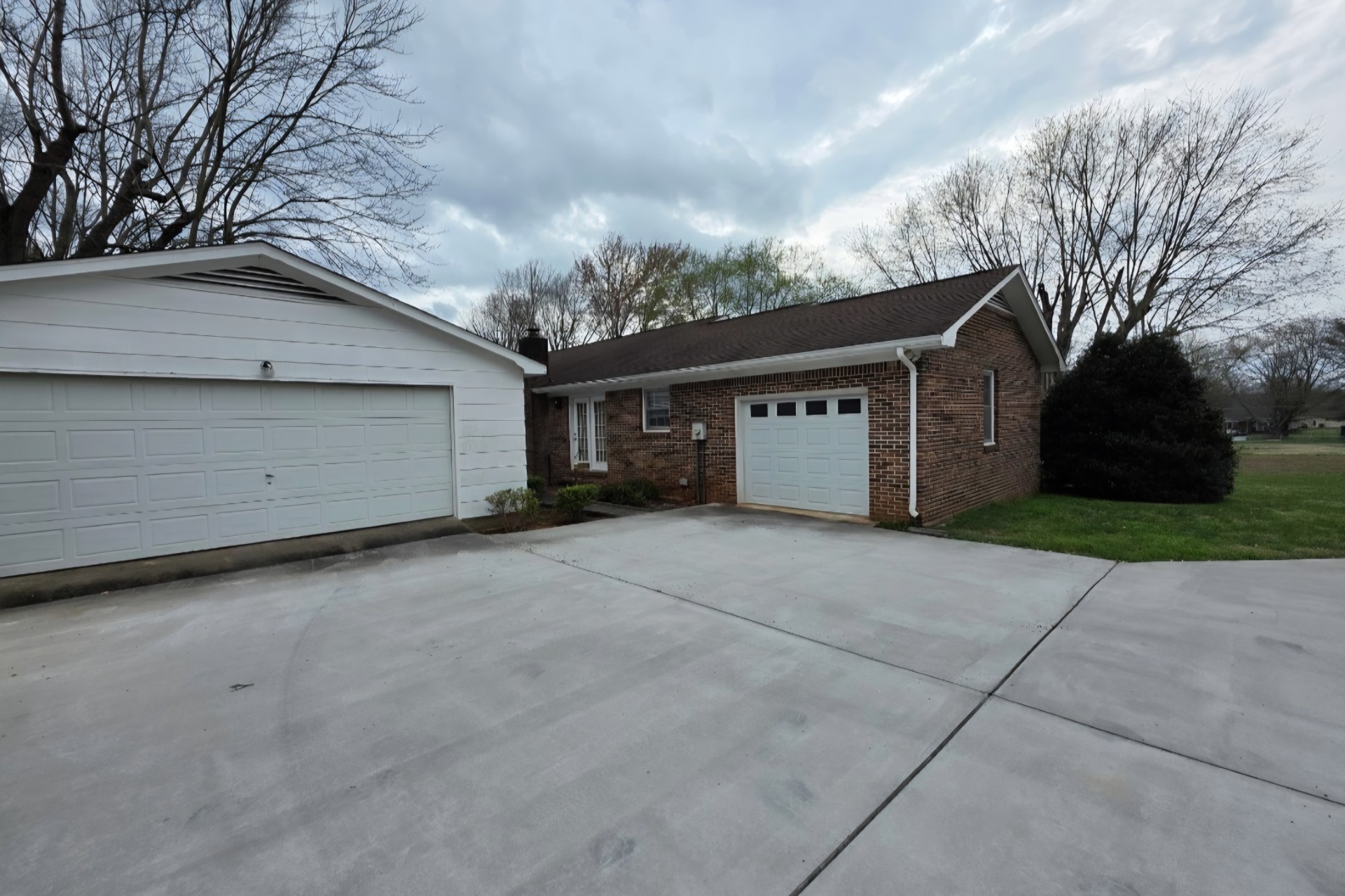 1587 Bypass Road Winchester, TN 37398 - Photo 7 of 26 a view of a house with a yard and garage