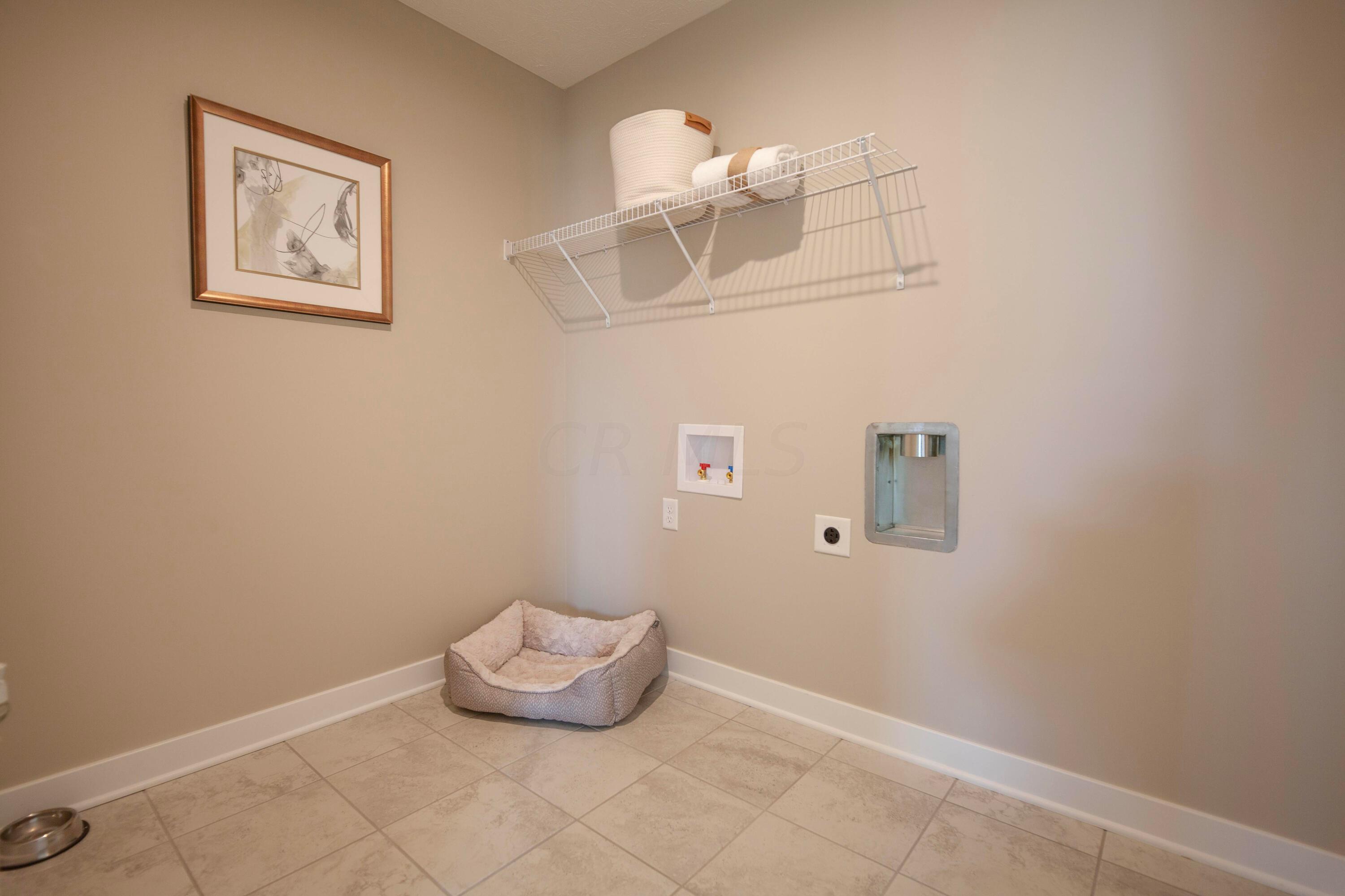 97 Firenze Road Delaware, OH 43015 - Photo 14 of 30 Laundry room has plenty of space for washer and dryer as well as for additional storage, folding table or hanging rack