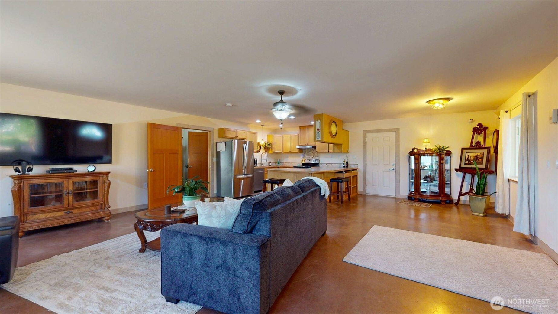 46 Shumway Road Omak, WA 98841 - Photo 9 of 40 a living room with furniture and a flat screen tv