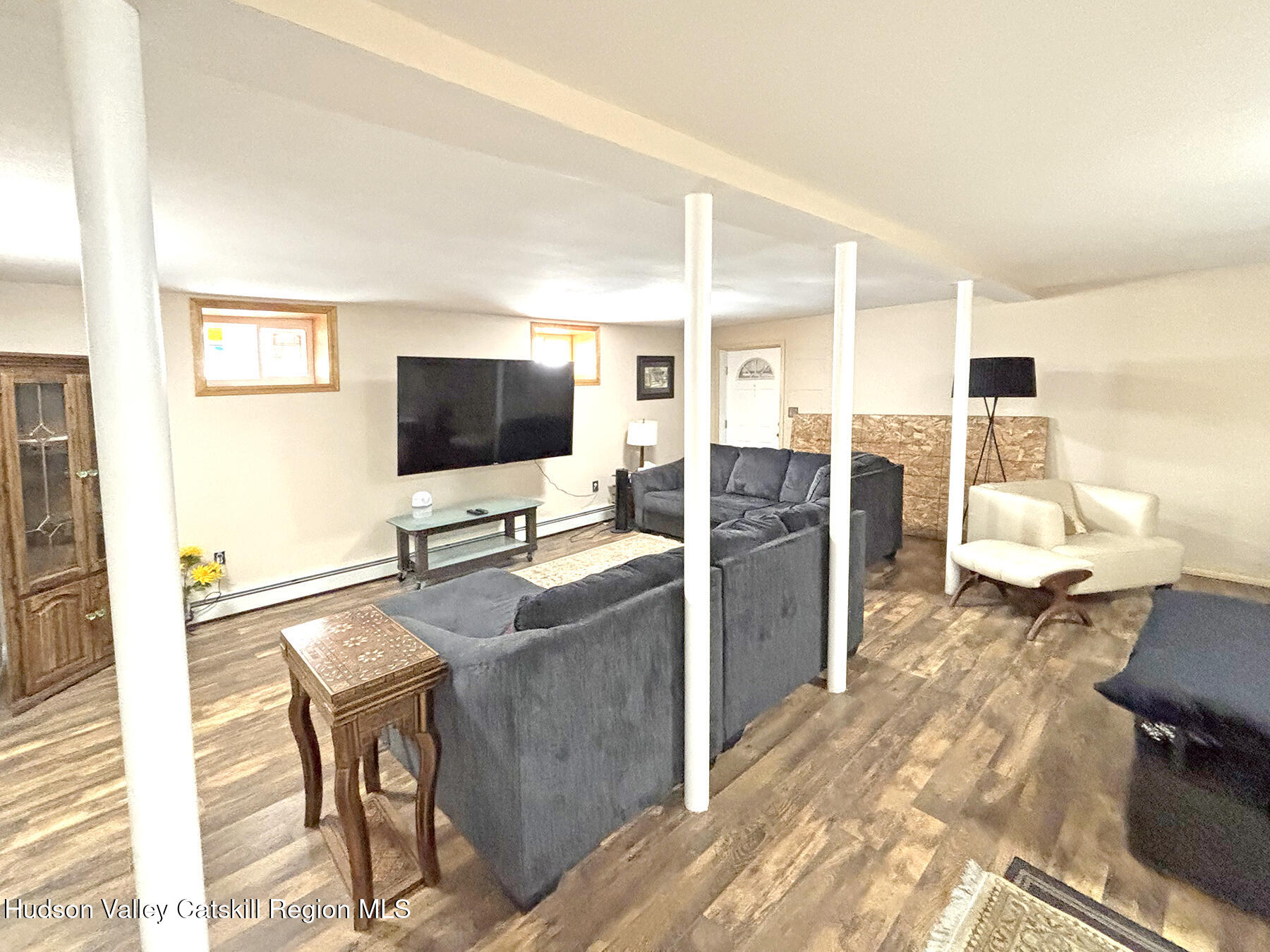 14 Park Road Chichester, NY 12416 - Photo 27 of 37 a living room with furniture and a flat screen tv