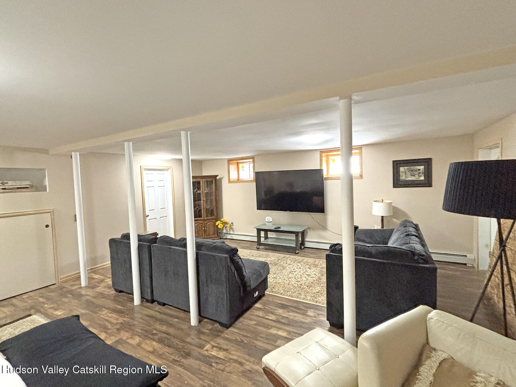 14 Park Road Chichester, NY 12416 - Photo 28 of 37 a living room with furniture and a flat screen tv