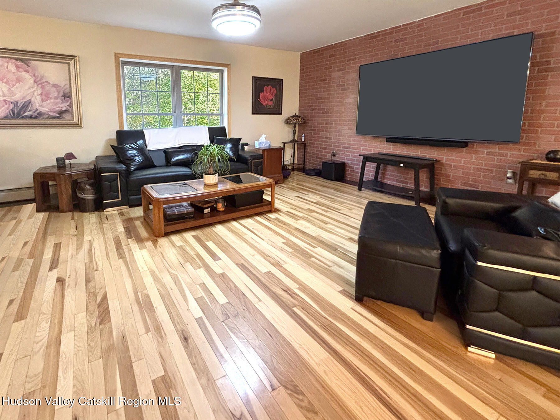 14 Park Road Chichester, NY 12416 - Photo 4 of 37 a living room with furniture and a flat screen tv