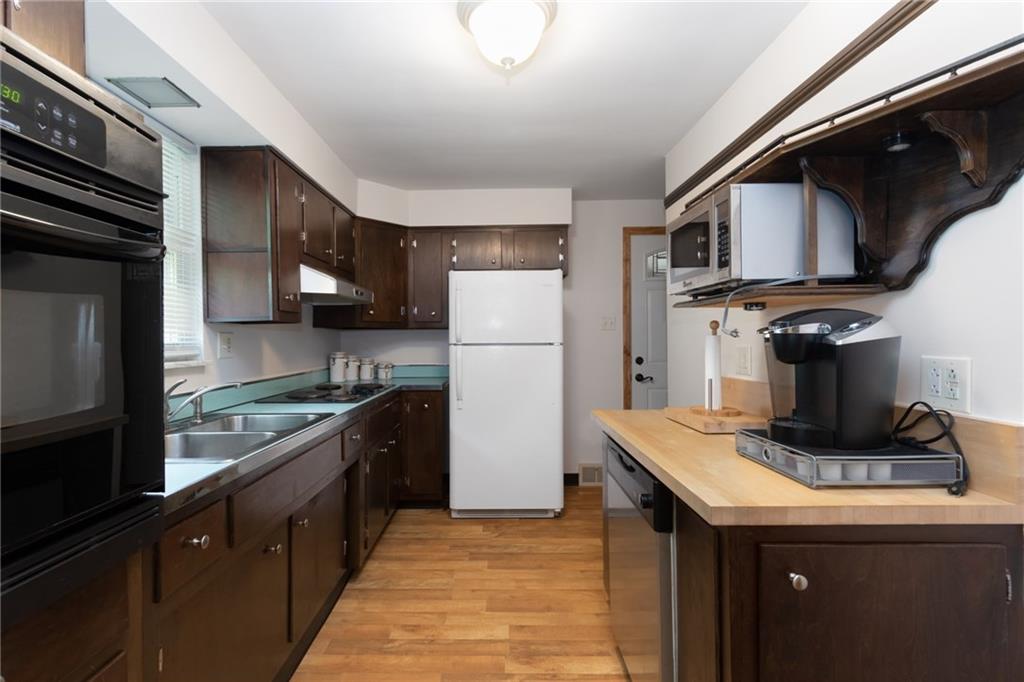 View of the kitchen from the DR... and it connects to the enclosed sunporch.  