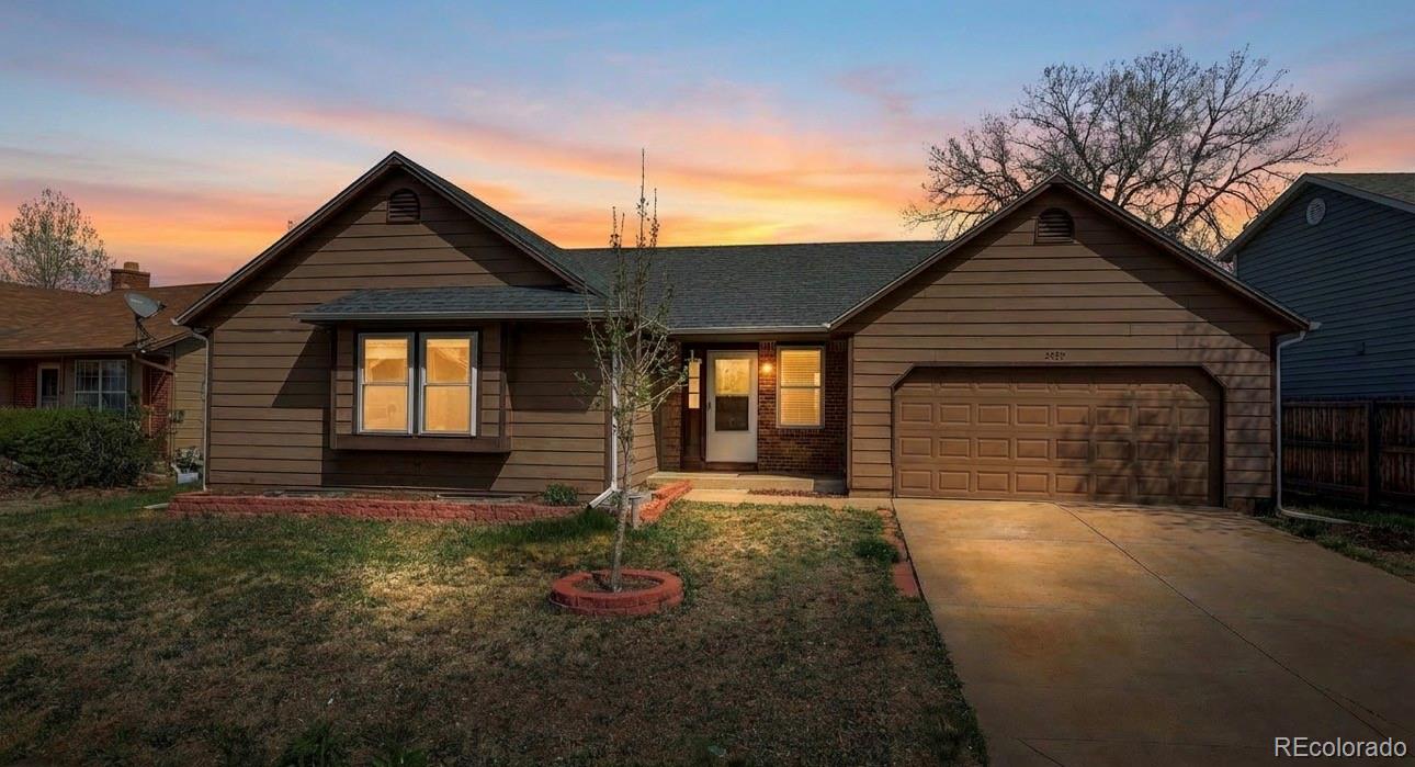 4550 Eugene Way Denver, CO 80239 - Photo 1 of 21 front view of a house with yard