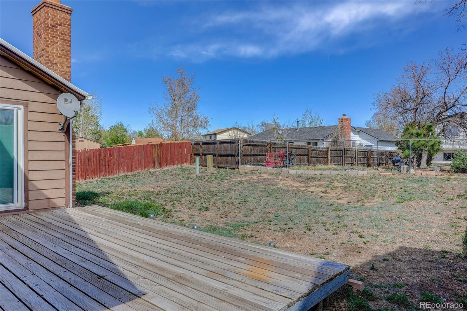 4550 Eugene Way Denver, CO 80239 - Photo 17 of 21 a pathway of a house with a yard