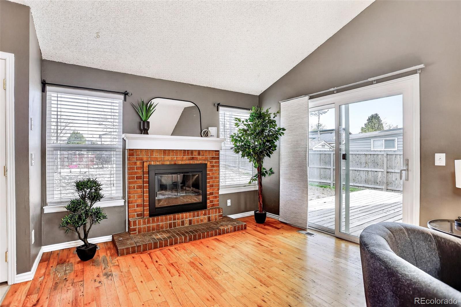4550 Eugene Way Denver, CO 80239 - Photo 5 of 21 a living room with furniture and a fireplace