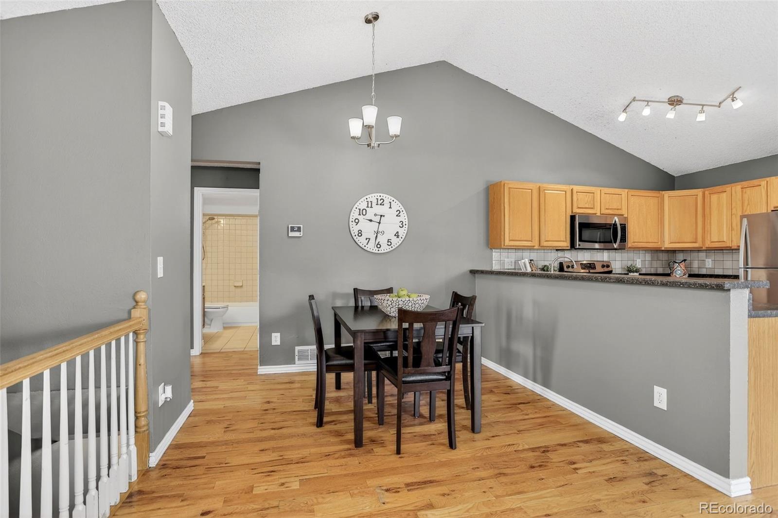 4550 Eugene Way Denver, CO 80239 - Photo 9 of 21 a view of a dining room with furniture and chandelier