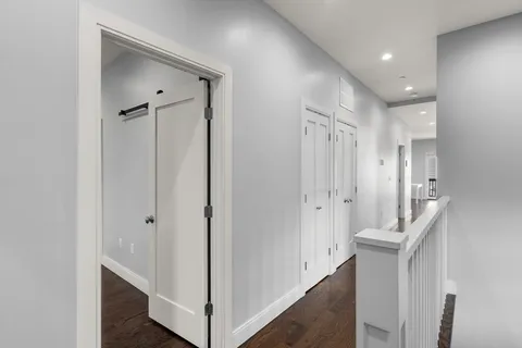 a hallway with white doors