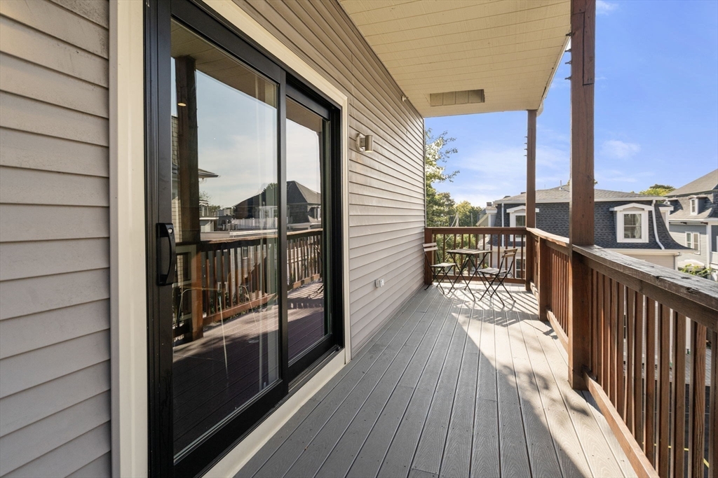 7 Langford Park, Unit 3 Boston, MA 02119 - Photo 12 of 16 a view of a balcony with wooden floor