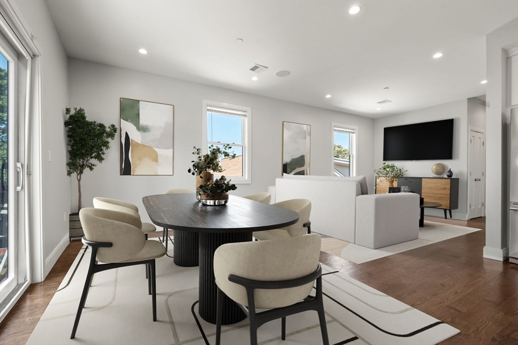 7 Langford Park, Unit 3 Boston, MA 02119 - Photo 3 of 16 a living room with furniture and a flat screen tv