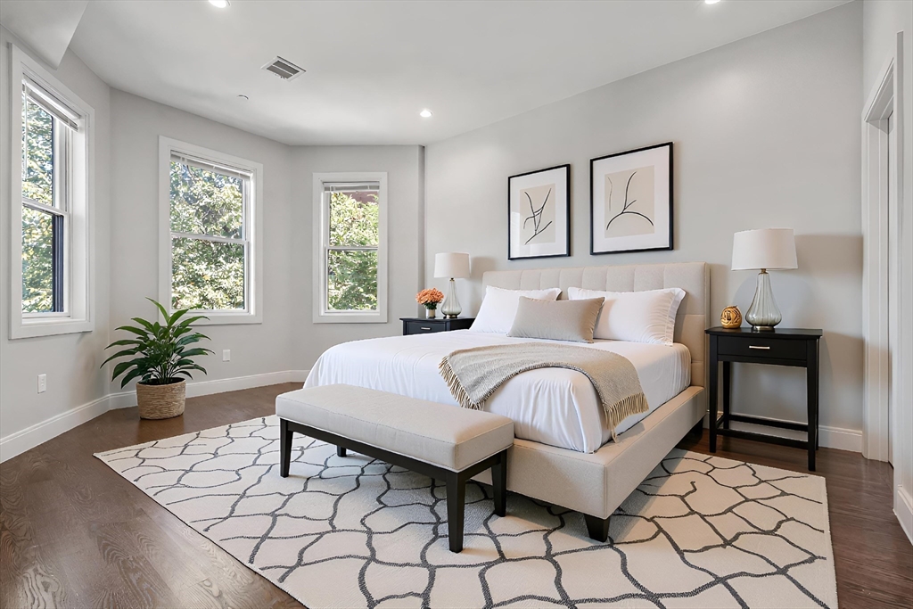 7 Langford Park, Unit 3 Boston, MA 02119 - Photo 5 of 16 a bedroom with a large bed and a potted plant