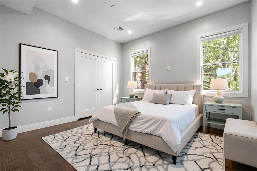 7 Langford Park, Unit 3 Boston, MA 02119 - Photo 6 of 16 a bedroom with a large bed and a window