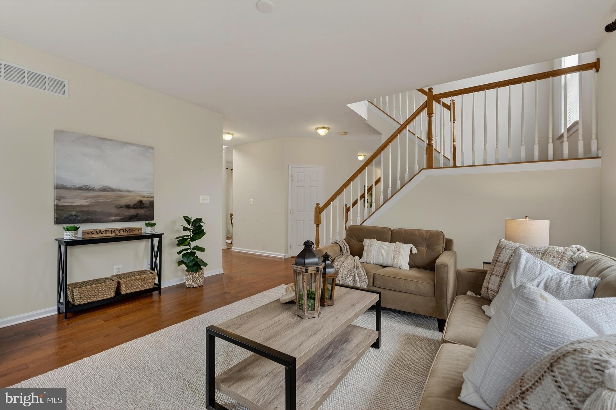 169 Thomas Jefferson Terrace Elkton, MD 21921 - Photo 18 of 64 a living room with furniture and a wooden floor
