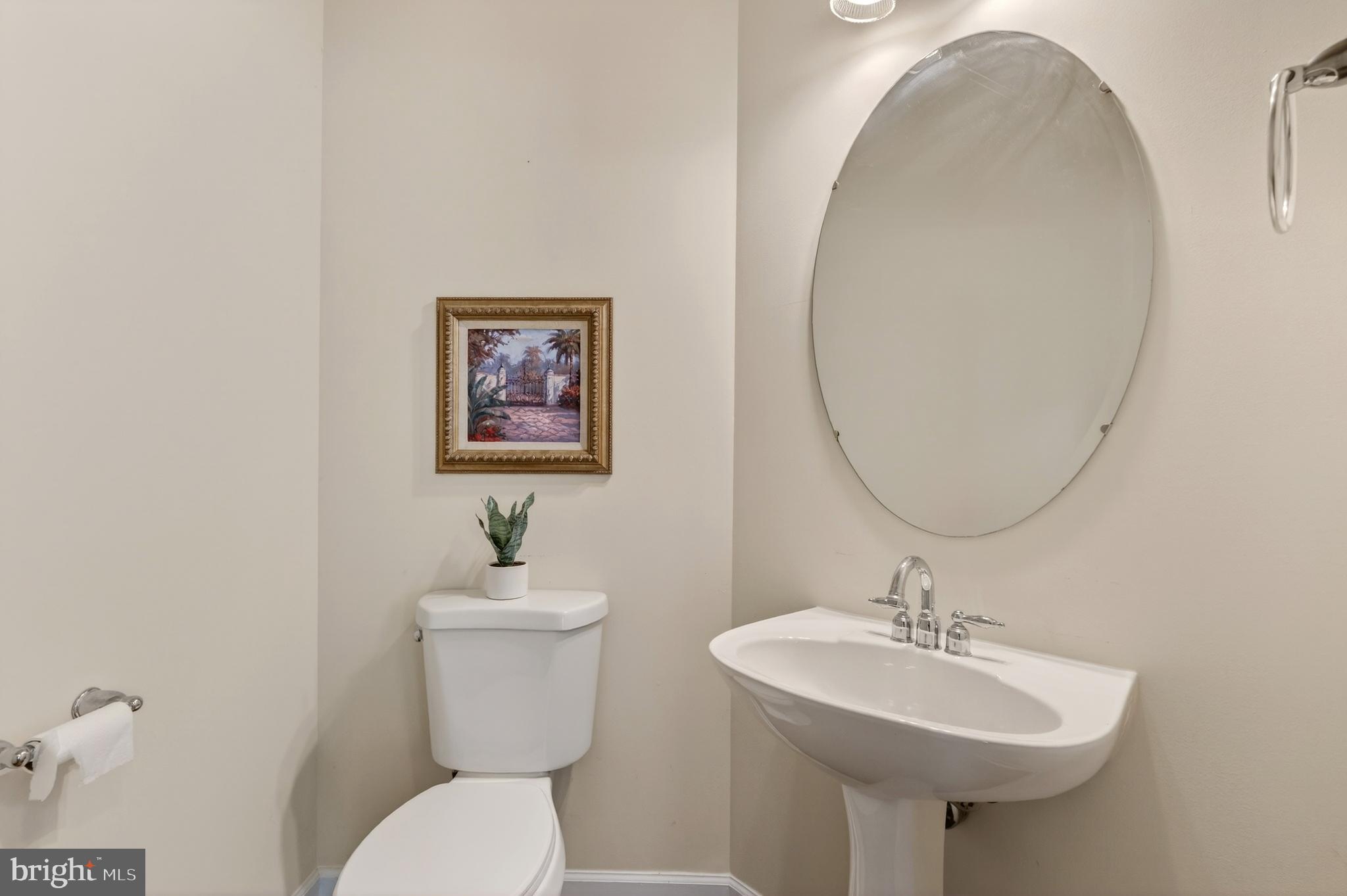 169 Thomas Jefferson Terrace Elkton, MD 21921 - Photo 19 of 64 a bathroom with a toilet a sink and a mirror