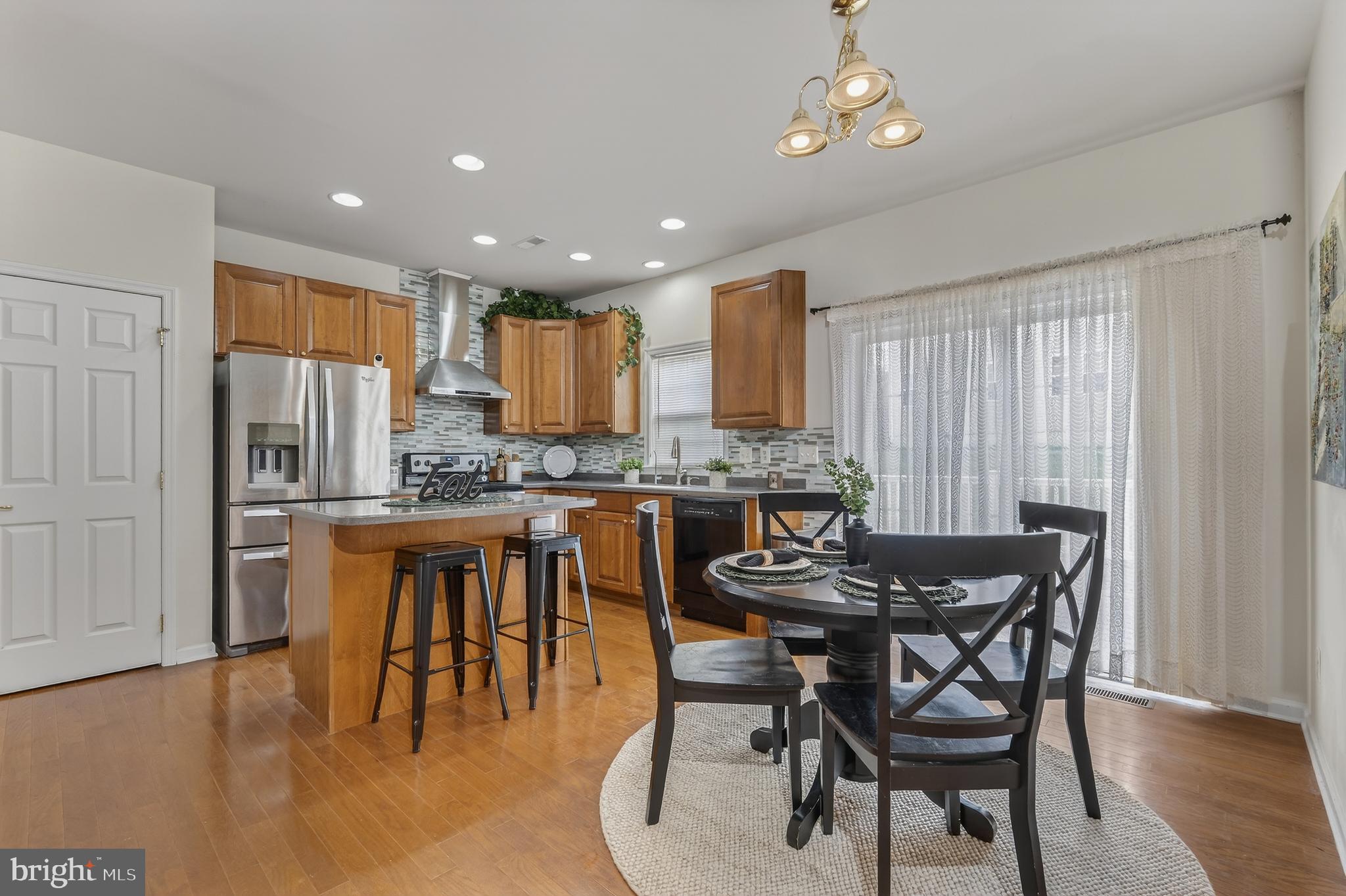 169 Thomas Jefferson Terrace Elkton, MD 21921 - Photo 20 of 64 a kitchen with stainless steel appliances granite countertop a dining table chairs and granite counter tops