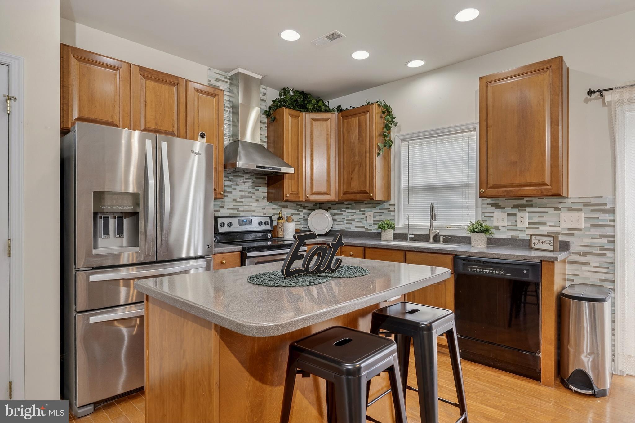 169 Thomas Jefferson Terrace Elkton, MD 21921 - Photo 23 of 64 a kitchen with stainless steel appliances a sink stove and refrigerator