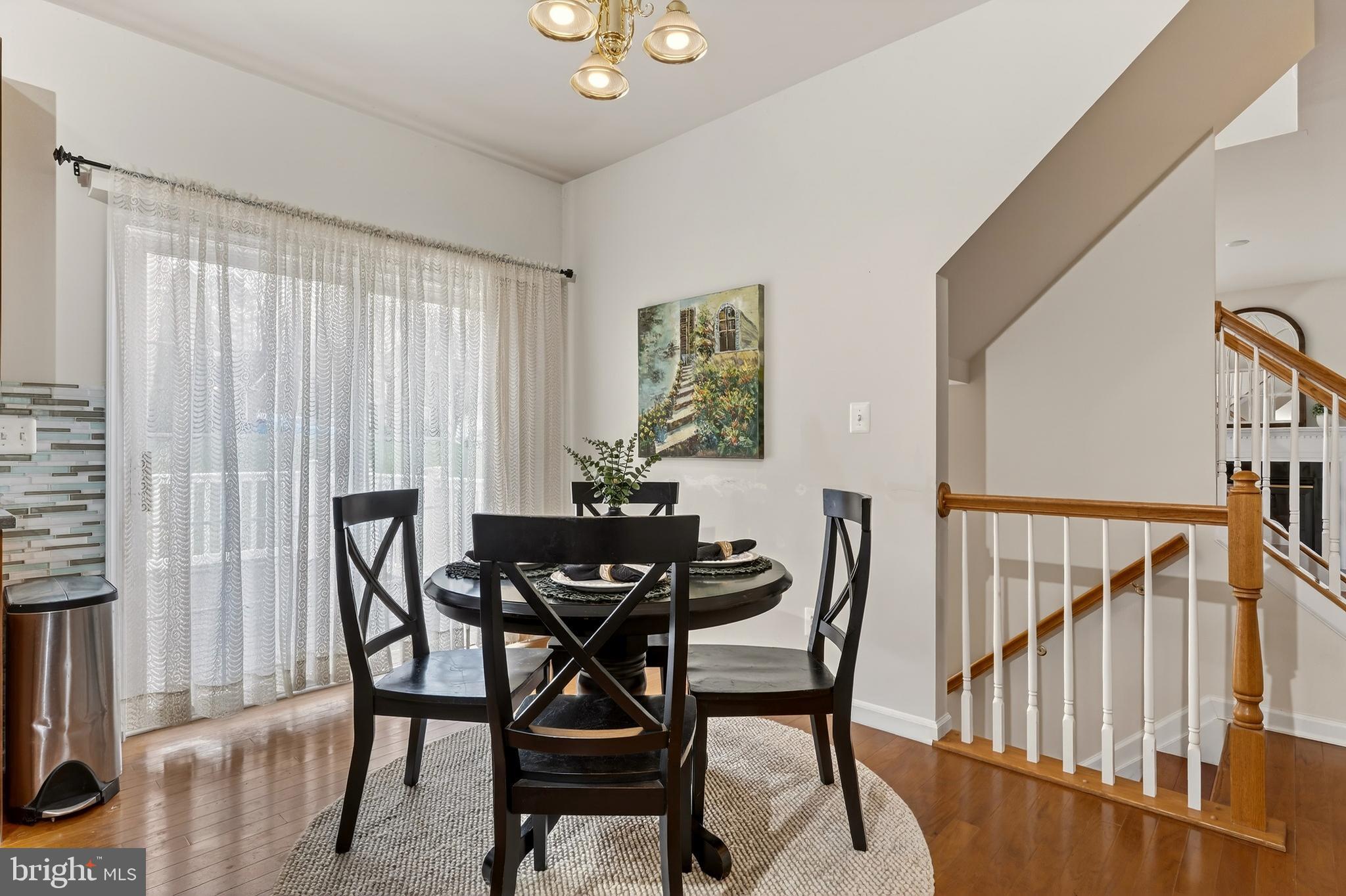 169 Thomas Jefferson Terrace Elkton, MD 21921 - Photo 26 of 64 a view of a dining room with furniture and chandelier