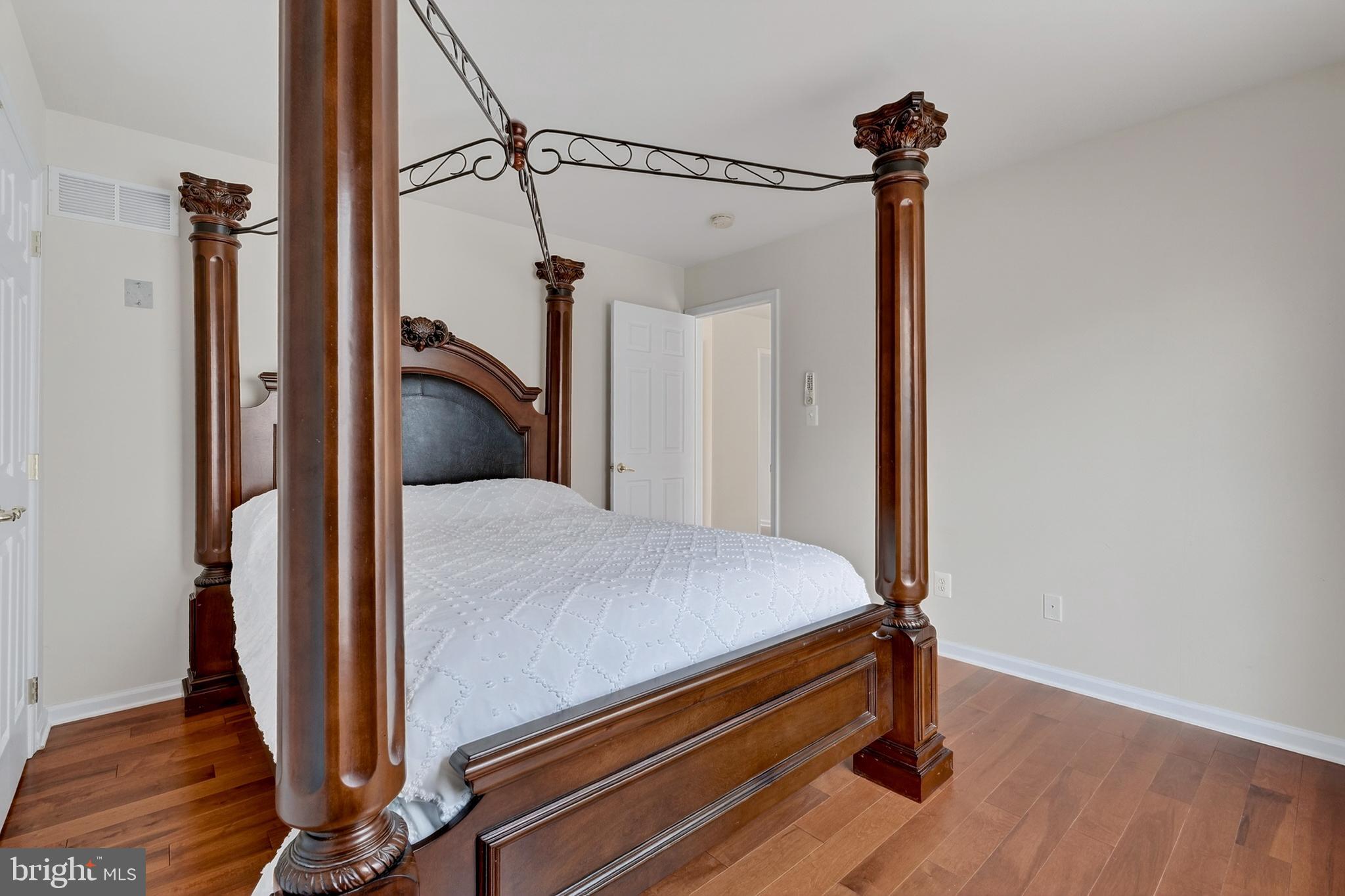 169 Thomas Jefferson Terrace Elkton, MD 21921 - Photo 33 of 64 a bedroom with a bed and wooden floor