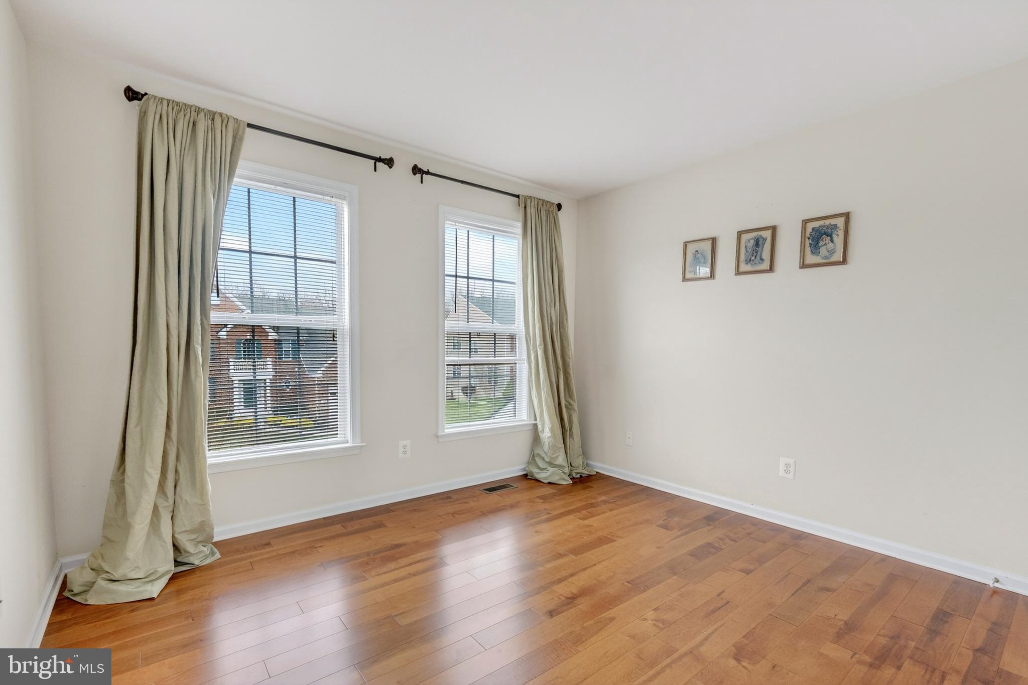 169 Thomas Jefferson Terrace Elkton, MD 21921 - Photo 38 of 64 an empty room with wooden floor and windows
