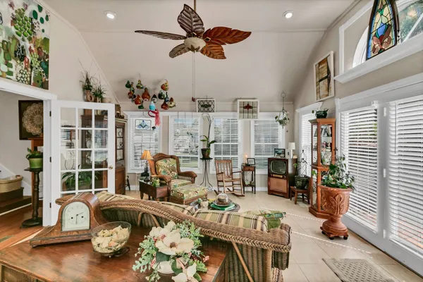 a living room with lots of furniture and a chandelier