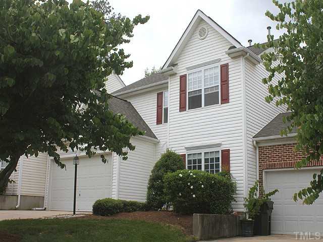 1127 Lake Moraine Place Raleigh, NC 27607 - Photo 1 of 23 a house that has a tree in front of the house
