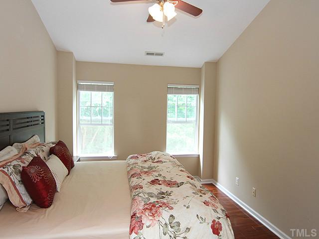 1127 Lake Moraine Place Raleigh, NC 27607 - Photo 13 of 23 a bedroom with a bed and a window
