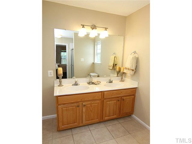 1127 Lake Moraine Place Raleigh, NC 27607 - Photo 15 of 23 a bathroom with a double vanity sink mirror and