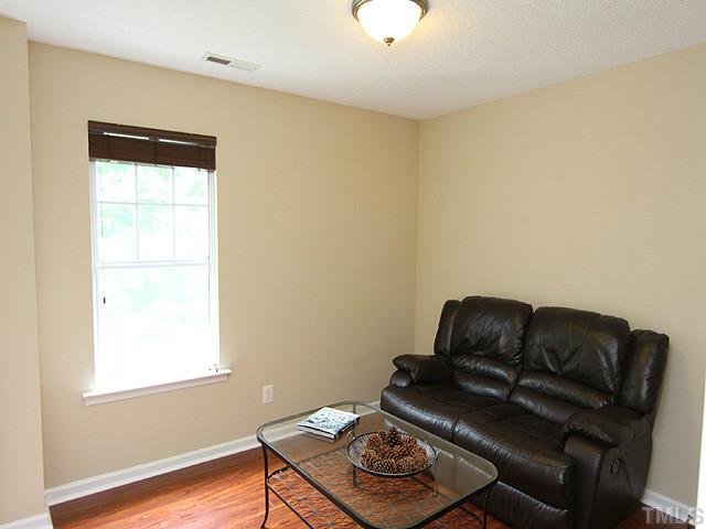 1127 Lake Moraine Place Raleigh, NC 27607 - Photo 19 of 23 a living room with furniture and a window