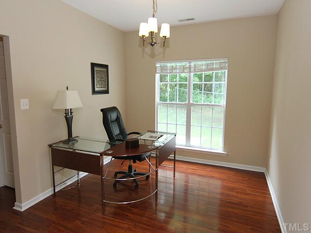 1127 Lake Moraine Place Raleigh, NC 27607 - Photo 6 of 23 a view of a workspace with furniture and a window