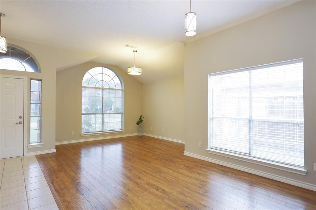 8112 Dock Street Frisco, TX 75035 - Photo 7 of 34 an empty room with wooden floor and windows