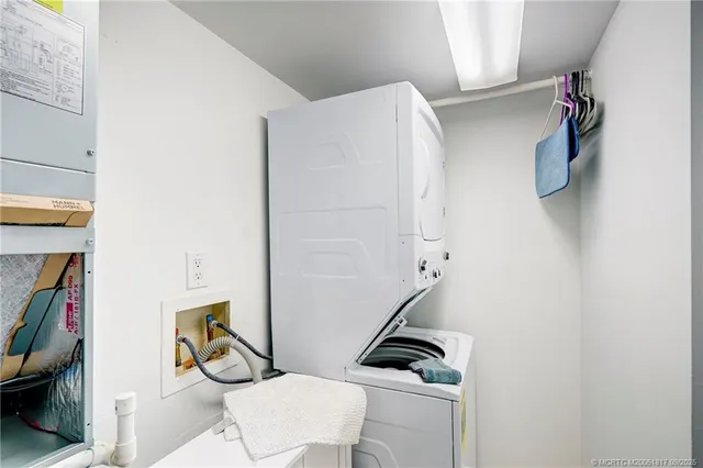 a picture of a bathroom with a bathtub and a painting on the wall