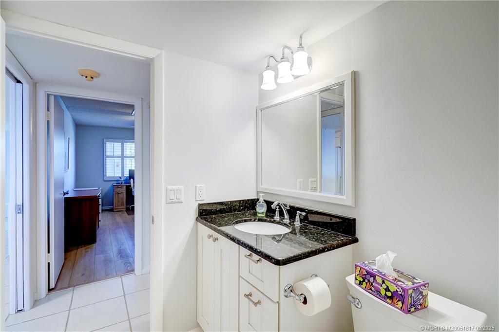10 Northeast Plantation Road, Unit 203 Stuart, FL 34996 - Photo 19 of 50 a bathroom with a sink and a mirror
