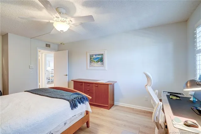 a view of a dining room with furniture and a chandelier