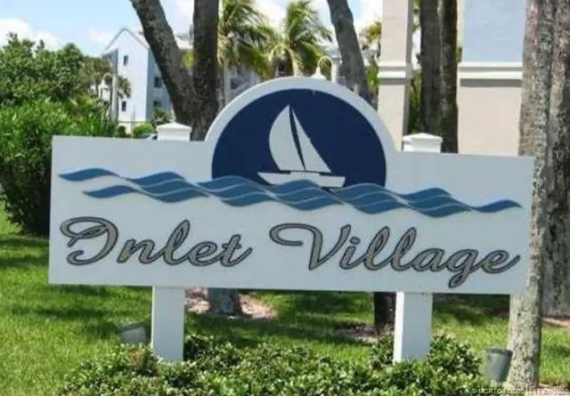 a view of outdoor space with a garden and trees