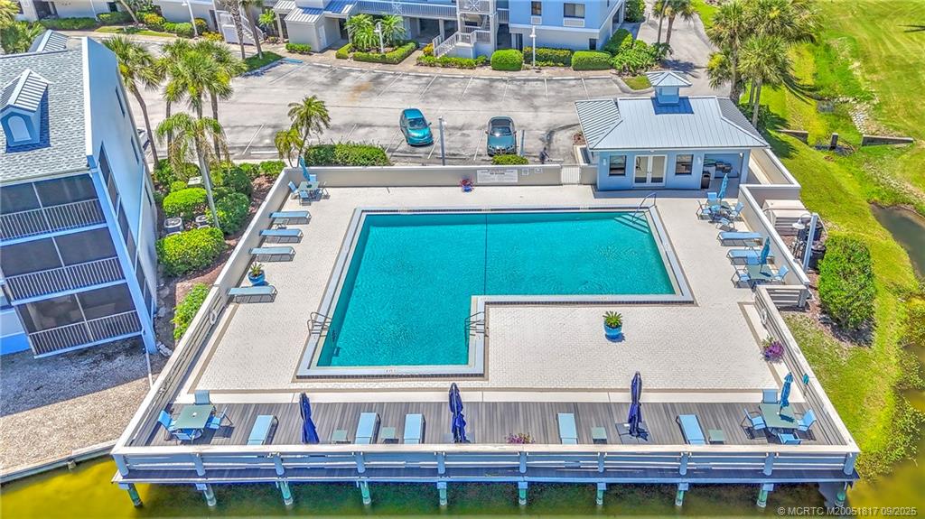 10 Northeast Plantation Road, Unit 203 Stuart, FL 34996 - Photo 41 of 50 a balcony with table and chairs