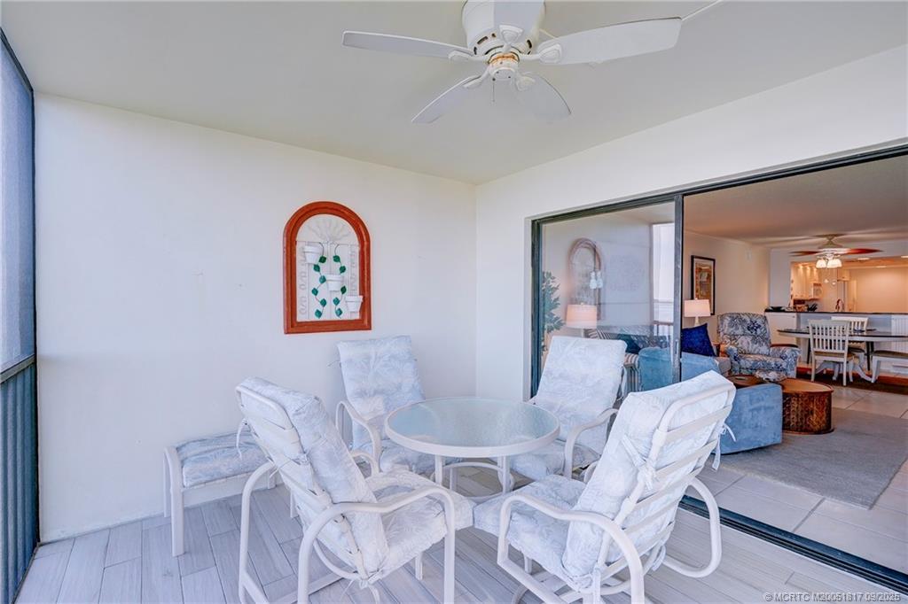 10 Northeast Plantation Road, Unit 203 Stuart, FL 34996 - Photo 42 of 50 a view of a dining room with furniture and wooden floor