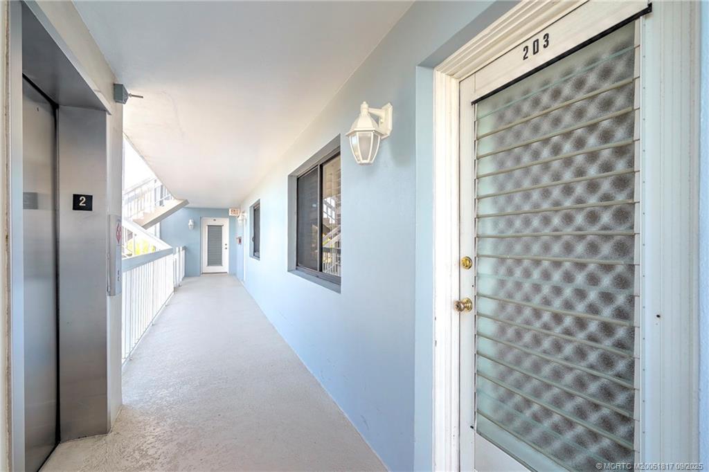 10 Northeast Plantation Road, Unit 203 Stuart, FL 34996 - Photo 47 of 50 a view of a hallway with windows