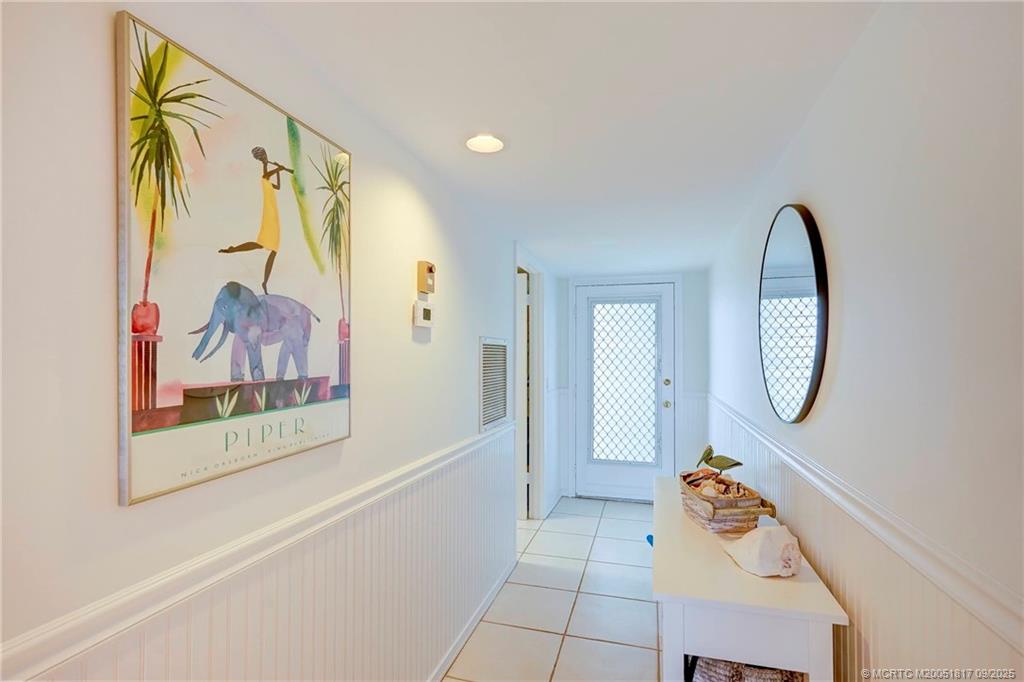 10 Northeast Plantation Road, Unit 203 Stuart, FL 34996 - Photo 49 of 50 a view of a hallway with painted walls