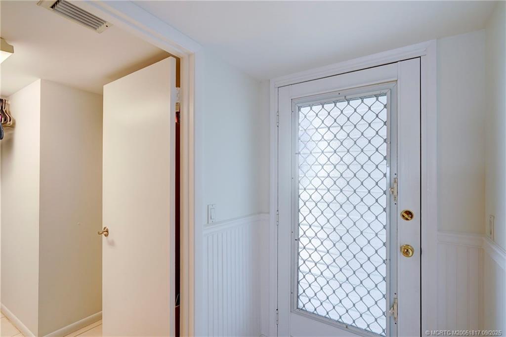 10 Northeast Plantation Road, Unit 203 Stuart, FL 34996 - Photo 10 of 50 a view of hallway with windows